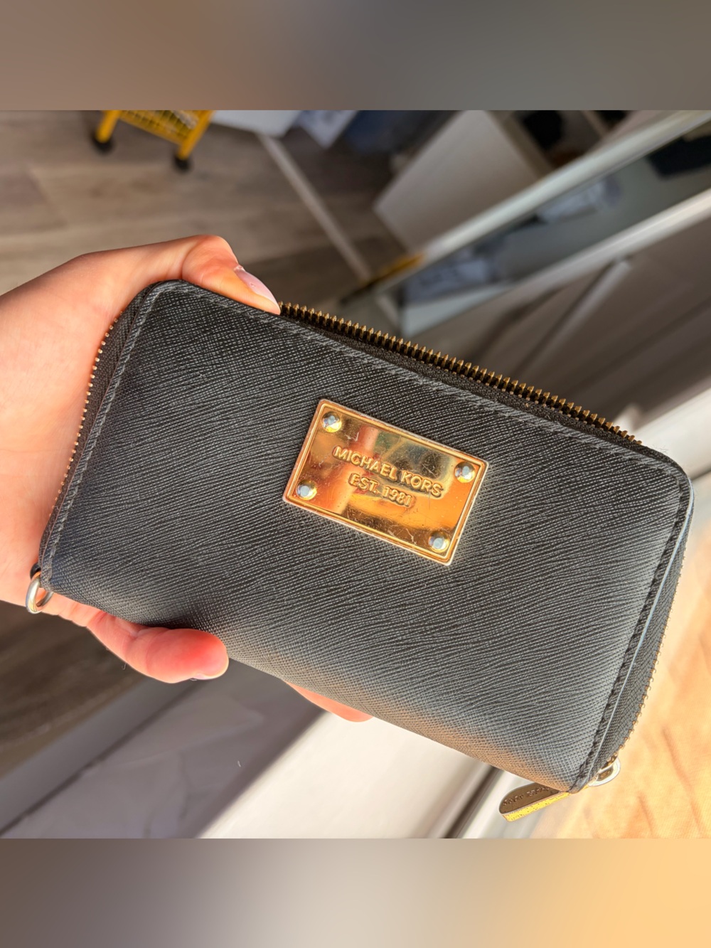 Michael Kors black wallet with gold plate and zipper